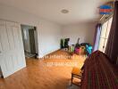 Living room with wooden flooring and large window