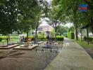 Outdoor exercise area in a park with fitness equipment and walkways