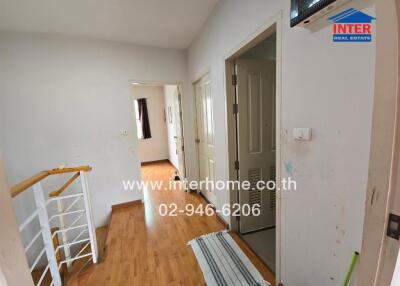 interior hallway in a house with wooden flooring