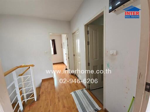 interior hallway in a house with wooden flooring