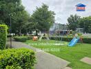 Community playground area with swings, slides, and greenery