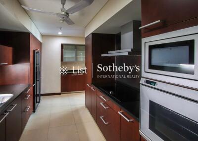 Modern kitchen with wooden cabinetry and stainless steel appliances