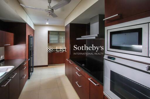 Modern kitchen with wooden cabinetry and stainless steel appliances