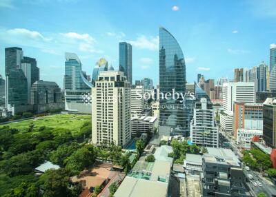 Cityscape view with modern buildings and green spaces