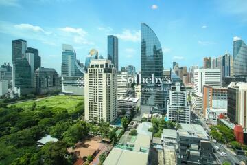 Cityscape view with modern buildings and green spaces