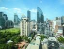 Cityscape view with modern buildings and green spaces