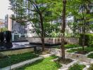 Green outdoor garden area with water feature