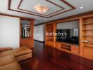 Spacious living room with wooden built-in storage and TV unit