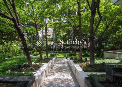 Beautifully landscaped garden with walking paths and lush greenery