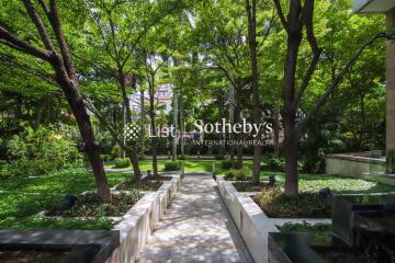 Beautifully landscaped garden with walking paths and lush greenery