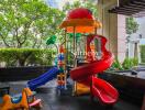 Outdoor kids' play area with slides and climbing structure