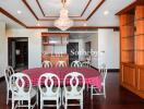 Elegant dining area with chandelier and round table