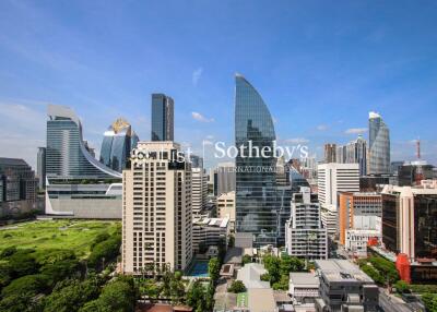 Panoramic cityscape view with modern skyscrapers and green space