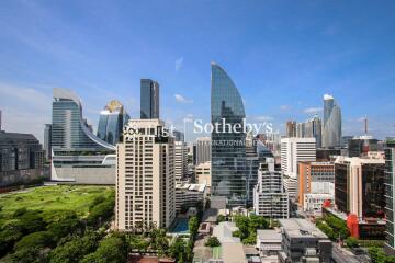 Panoramic cityscape view with modern skyscrapers and green space