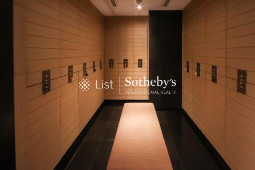 Luxury changing room with wooden lockers and dim lighting