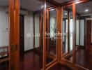 Spacious walk-in closet with mirrored sliding doors