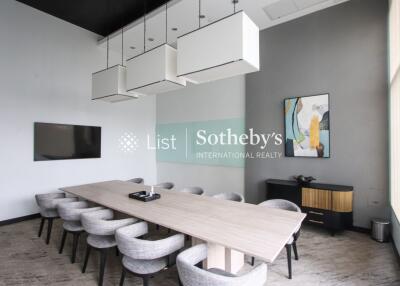 Modern conference room with a long table and chairs