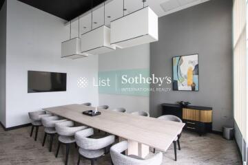 Modern conference room with a long table and chairs