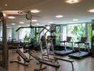 Well-equipped fitness center with various exercise machines and weights