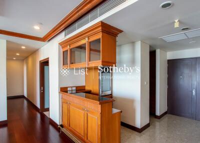 Modern kitchen area with wooden cabinets and built-in appliances