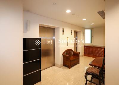 Well-lit living area with furniture and storage