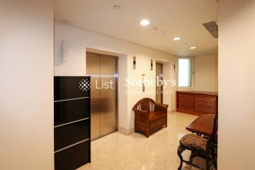 Well-lit living area with furniture and storage