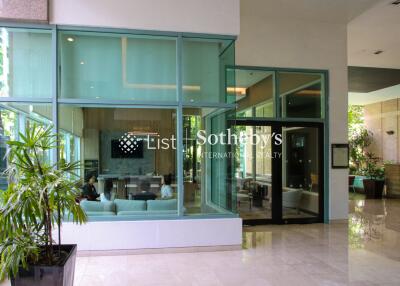 Modern lobby area with glass walls and sitting area