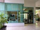 Modern lobby area with glass walls and sitting area