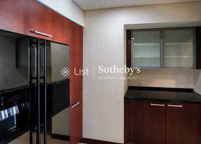 Modern kitchen with sleek appliances and wooden cabinetry