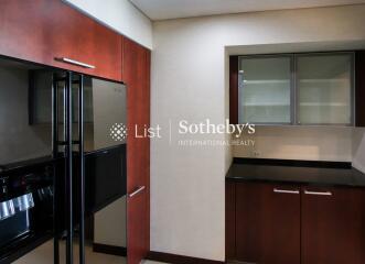 Modern kitchen with sleek appliances and wooden cabinetry