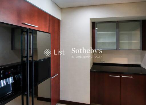 Modern kitchen with sleek appliances and wooden cabinetry