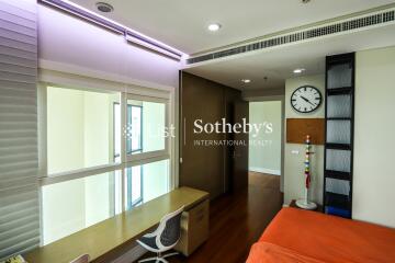 Modern bedroom with a study desk and large windows