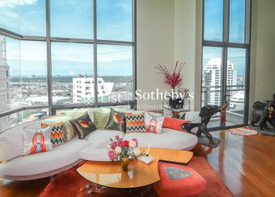 Modern living room with large windows and city view