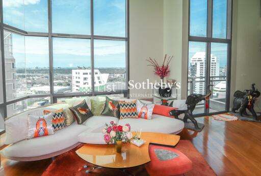 Modern living room with large windows and city view