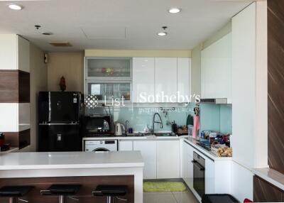 Modern kitchen with white cabinetry and built-in appliances