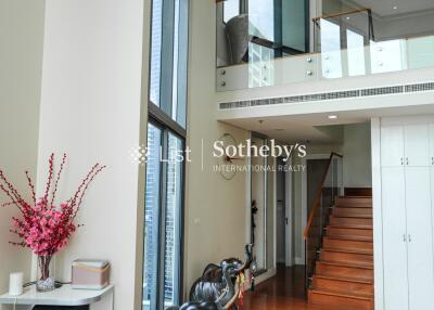 Modern living area with staircase and balcony