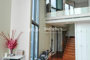 Modern living area with staircase and balcony