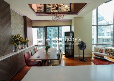 Modern dining and living space with city view