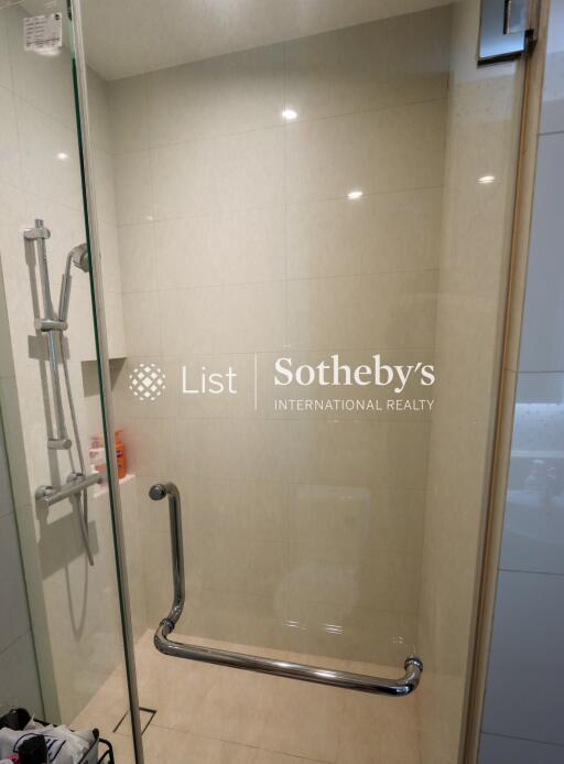 Shower area in a bathroom with a transparent glass door