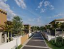 View of residential street with modern houses and palm trees