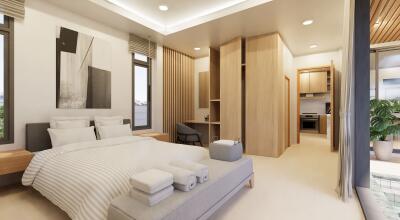 Modern bedroom with ensuite bathroom and study area