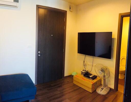 Living room with TV and door