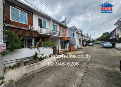 Street view of residential neighborhood with row houses