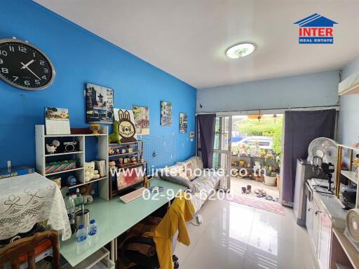 Bright living room with blue accent wall and modern decor