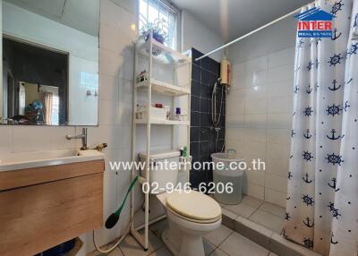 Bathroom with shower and shelving