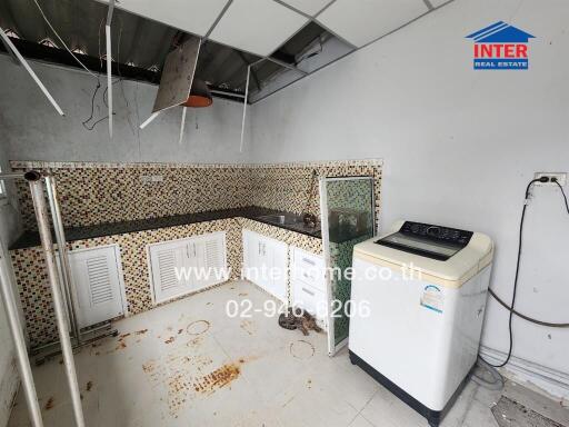 Home kitchen with appliances and tile backsplash