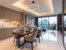 Modern open-plan kitchen and dining area with city view