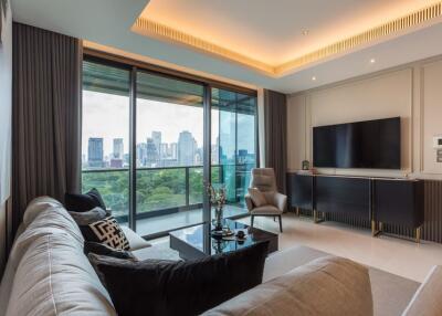 Spacious living room with modern furnishings and a city skyline view