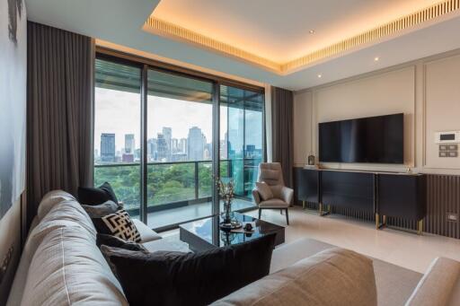 Spacious living room with modern furnishings and a city skyline view