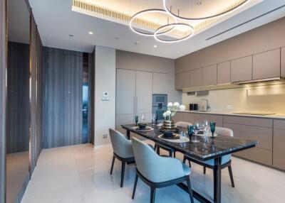 Modern dining room and kitchen with elegant lighting